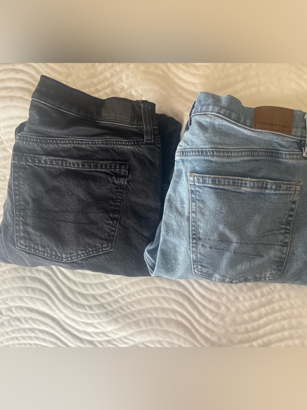 2 pairs of American Eagle Stovepipe jeans